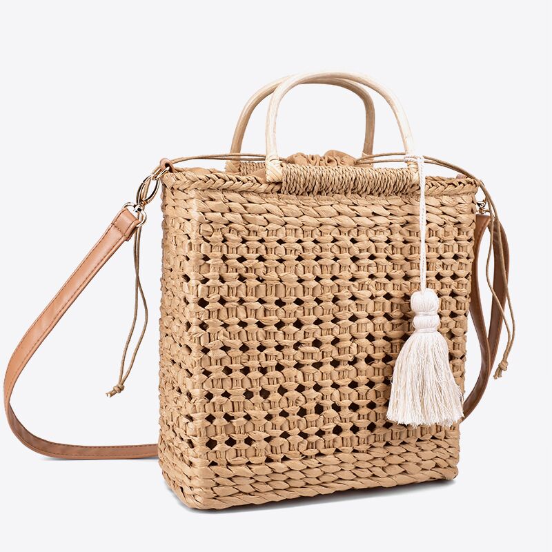 Hollow fringed woven straw bag